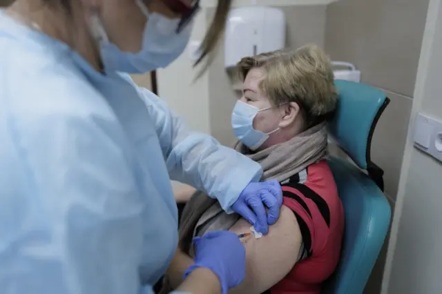 A teacher is vaccinated in Poland