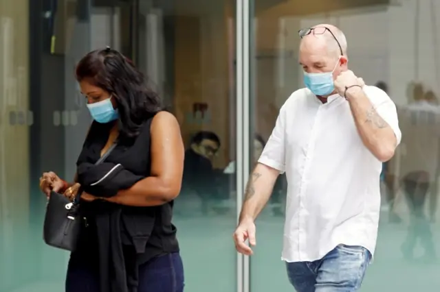 Nigel Skea and partner Agatha Maghesh Eyamalai arrive at the State Courts for an earlier hearing in February