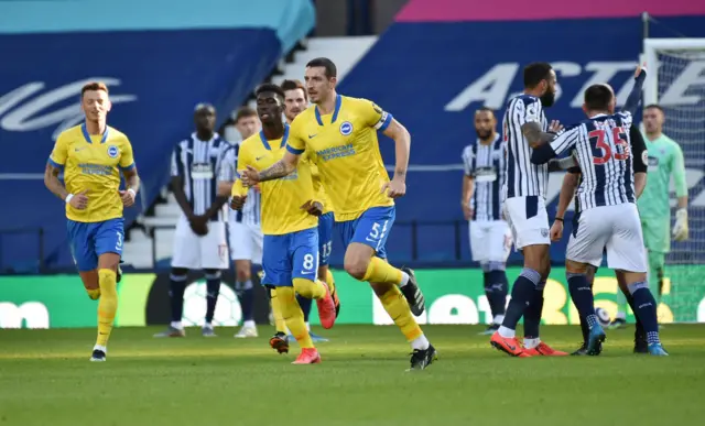 Lewis Dunk celebrates before his goal is disallowed