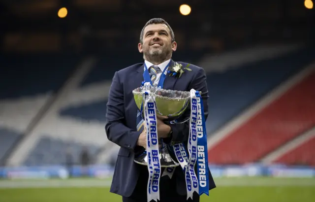 Callum Davidson keeps a tight hold on the trophy