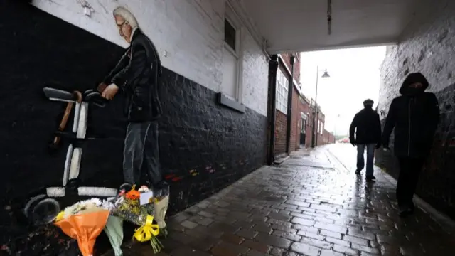 Tom Moore mural and flowers in Pontefract