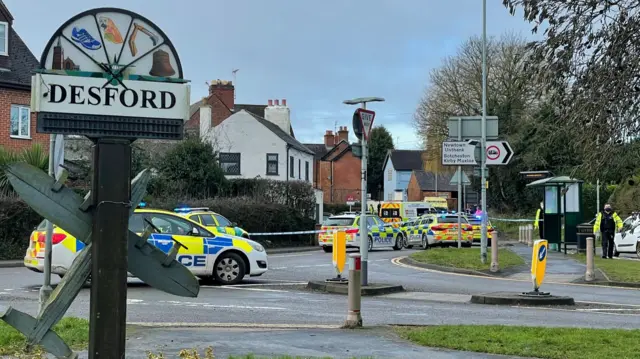 Police on High Street, in Desford, Leicestershire