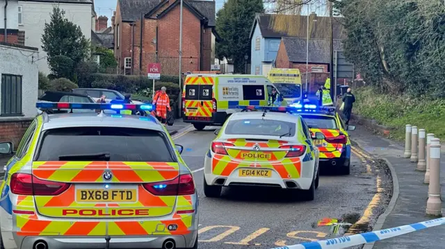 Police on High Street, in Desford, Leicestershire