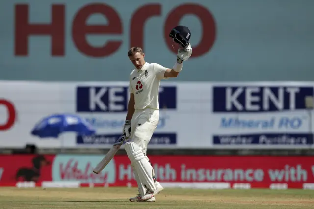 Joe Root celebrates his double century