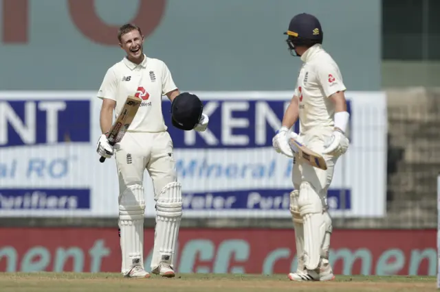 Joe Root celebrates his double century