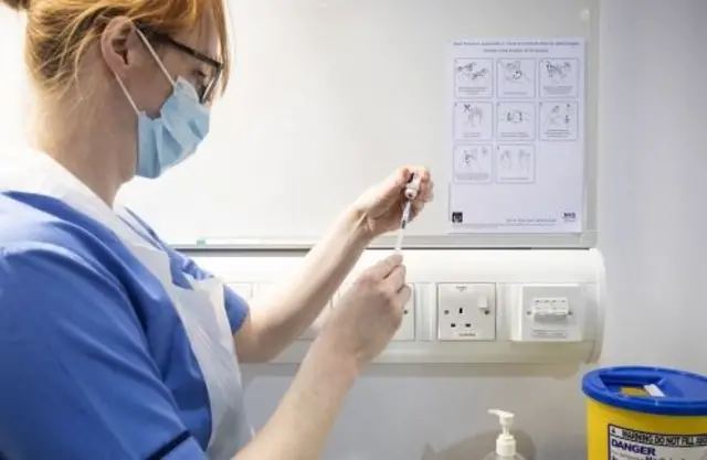 Nurse prepares Covid vaccine