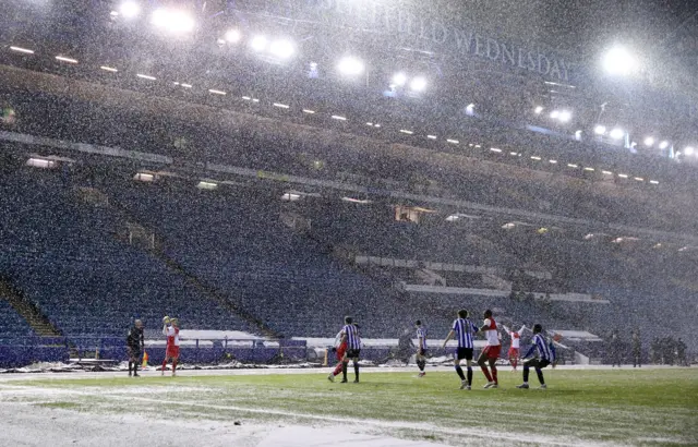 Sheffield Wednesday and Wycombe battle in the snow