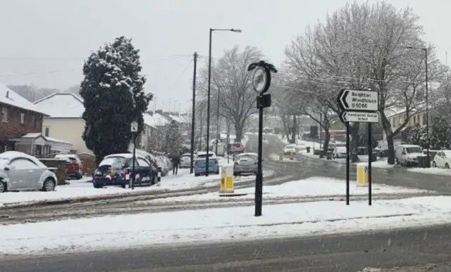 Cars parked on snowy verges