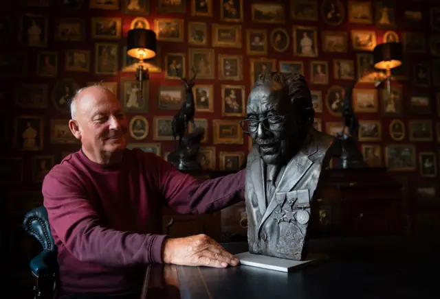 Garry McBride with the Captain Sir Tom bust