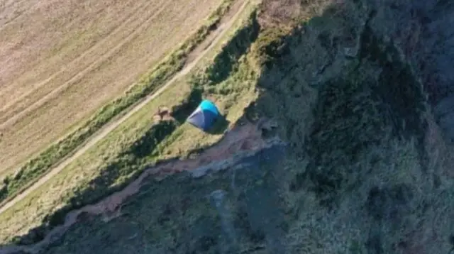 tent on cliff edge