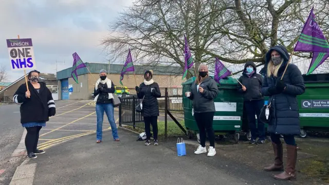 Six striking hospital workers during the first day of industrial action