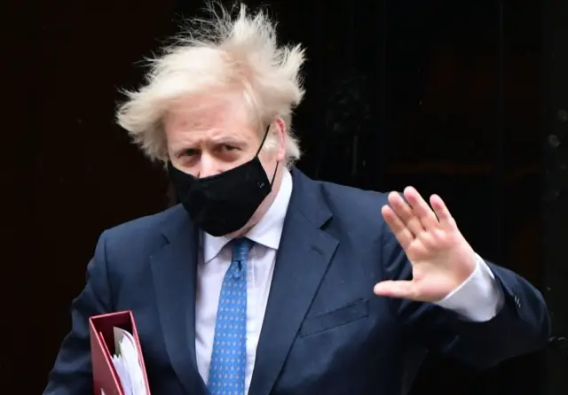 Johnson waves as he leaves No 10