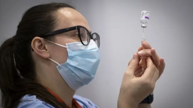 A health official administers a Covid vaccine