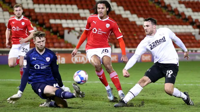 Brad Collins saves a shot by Lee Gregory