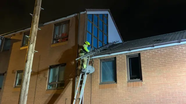 Fire crews removing the panels