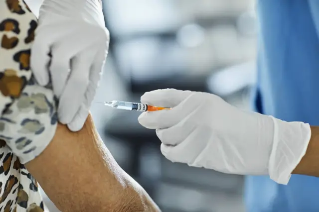 Stock image of someone receiving the vaccination