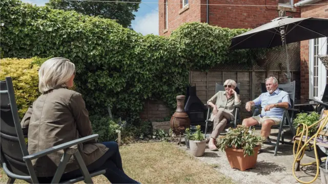 Socially-distanced meeting in a garden