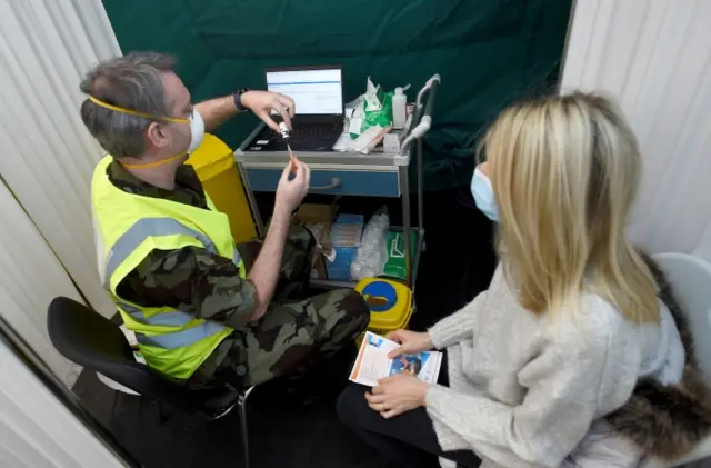 A man prepares a Covid vaccine in Dublin