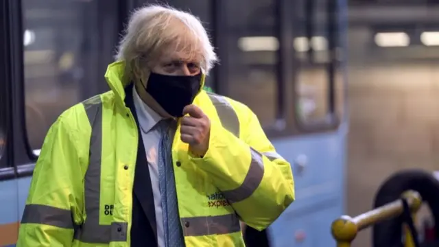 Boris Johnson during a visit to the National Express depot in Coventry