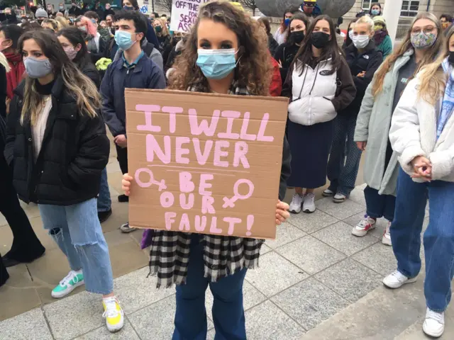 Member of the public at vigil at Millennium Square in Leeds