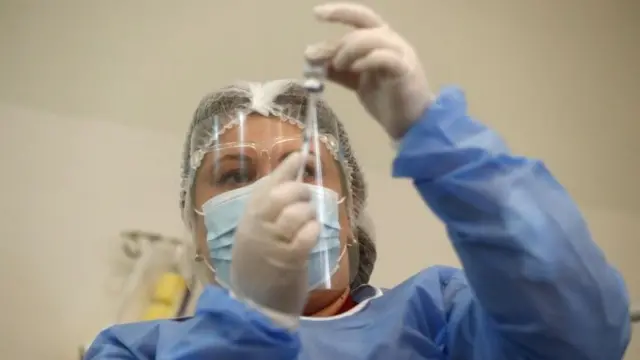 A health worker prepares Oxford-AstraZeneca COVID-19 vaccine in Tbilisi, Georgia, 15 March 2021