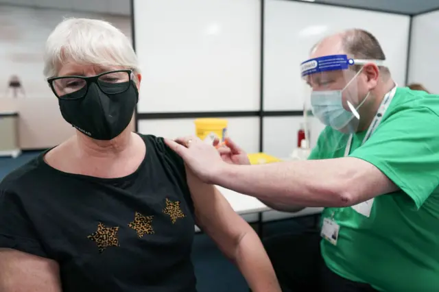 A woman having a vaccination