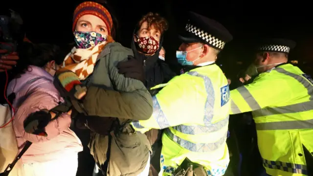 Police and women at vigil