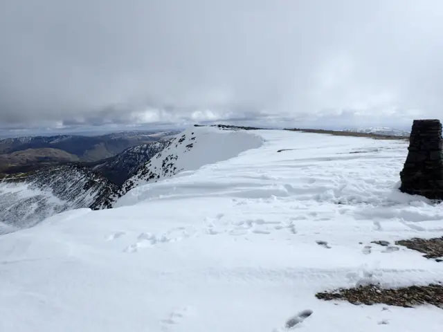 Helvellyn's Trig Point and snow