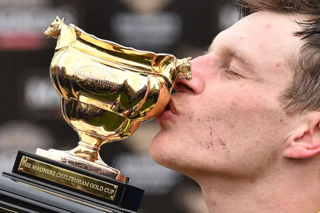 rish jockey Paul Townend poses with the trophy after riding Al Boum Photo to win the 2019 Gold Cup