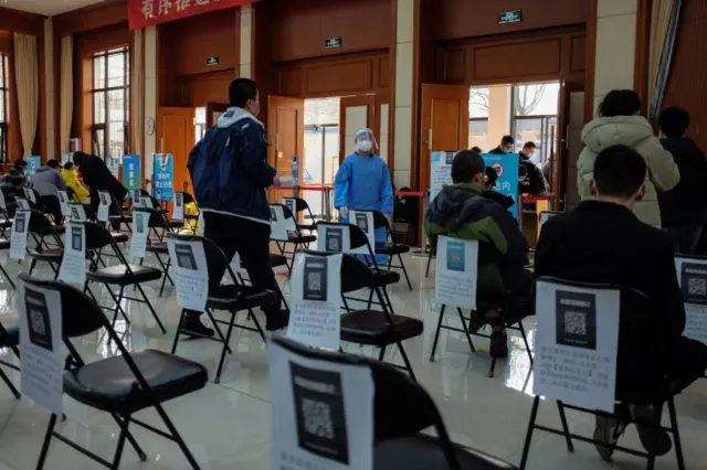 People queue to be vaccinated in Beijing - 27 February