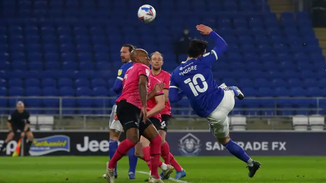 Kieffer Moore volleys over