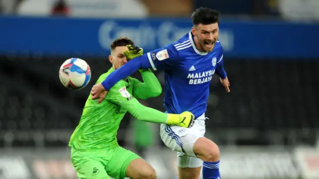 Kieffer Moore challenged by Freddie Woodman