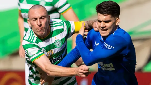 Celtic's Scott Brown tackles Rangers' Ianis Hagi