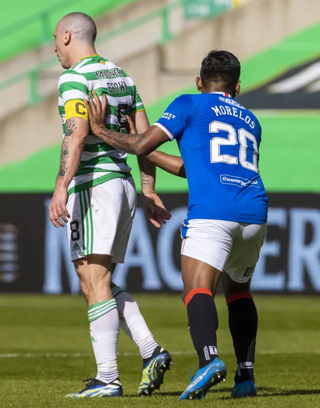 Scott Brown and Alfredo Morelos tussle in the first half