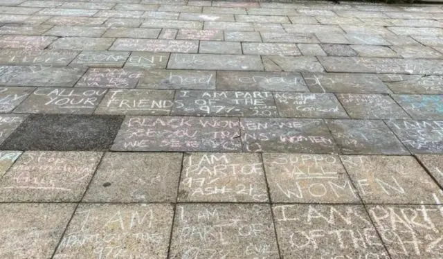 messages chalked onto the pavement