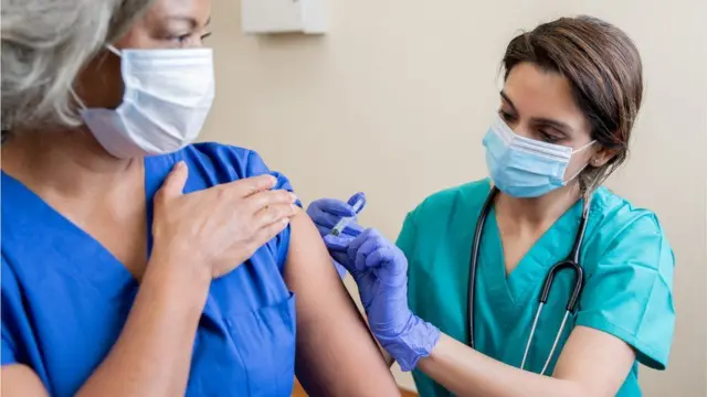 Care staff being vaccinated