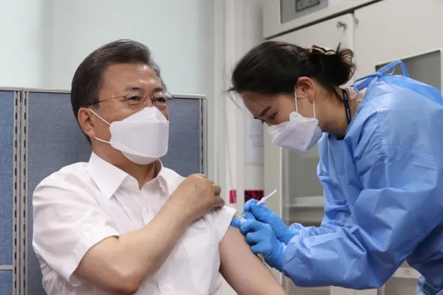 South Korean President Moon Jae-in receives a shot of AstraZeneca's vaccine