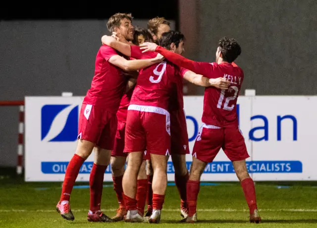 Brora players celebrate Martin MacLean's goal to make it 2-1