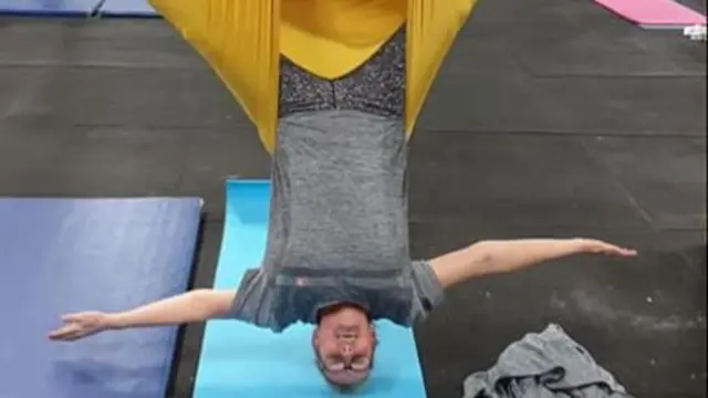 Jean Egan Howes doing aerial yoga