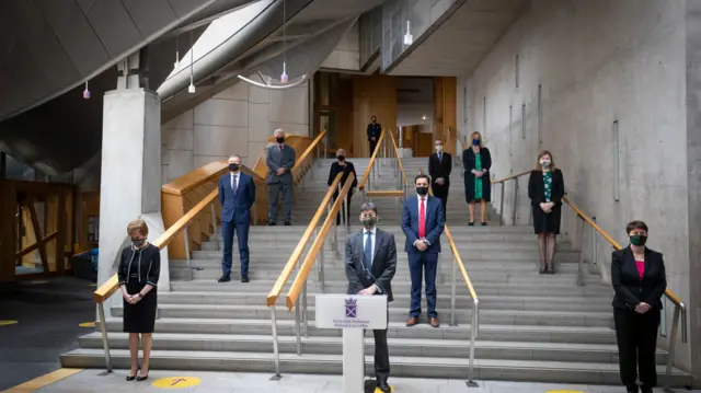 First Minister Nicola Sturgeon (left), Presiding Officer Ken Macintosh (centre) and Scottish Conservative Ruth Davidson (right), along with other MSPs and Parliament staff, observe a minute"s silence in the Garden Lobby of the Scottish Parliament at Holyrood, Edinburgh,