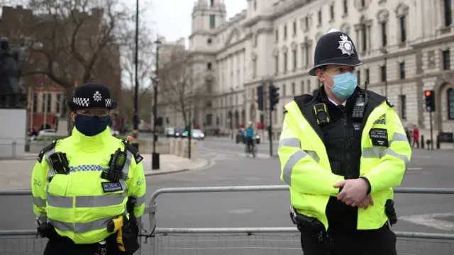 Police officers observe a minute's silence