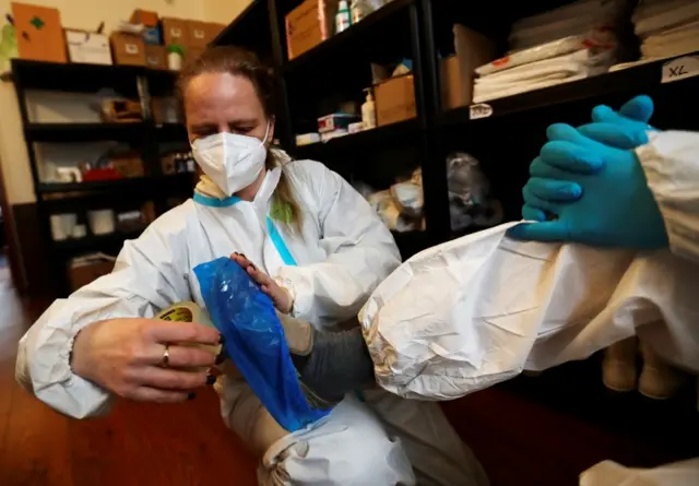 Healthcare workers prepare to treat homeless people infected with the coronavirus in Prague, Czech Republic