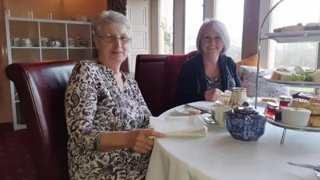 Two women having afternoon tea