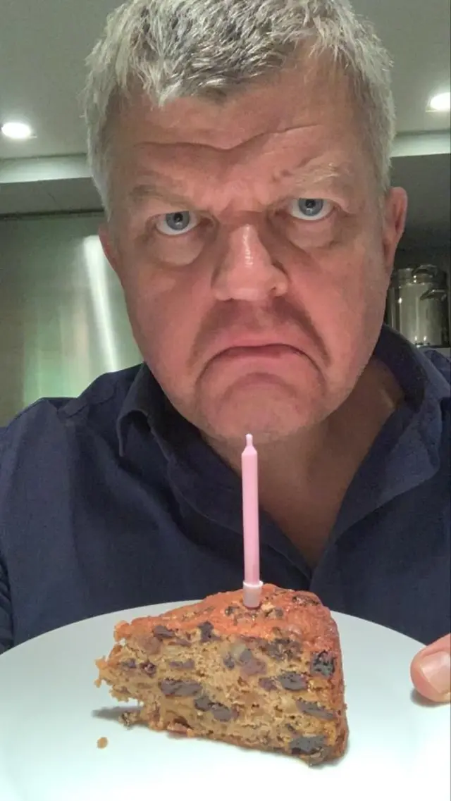 Adrian Chiles with his birthday cake