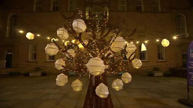 Tree decorated with hand-made lanterns