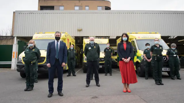 Labour leader Keir Starmer and shadow Chancellor of the Duchy of Lancaster, Rachel Reeves join paramedics at Deptford Ambulance station, south-east London, to observe a minute"s silence in memory of the lives lost to COVID-19 during the National Day of Reflection on the anniversary of the first national lockdown.