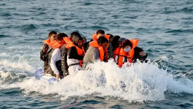 Migrants crossing the English Channel in a small dinghy in 2019