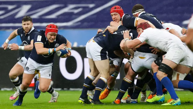 Scotland's George Turner breaks through before the first try of the match