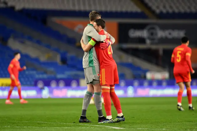 Chis Gunter and Wayne Hennessey hug