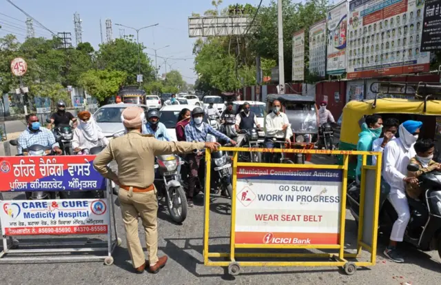 Police blocked roads in Amritsar, Punjab to enforce a one-hour silence